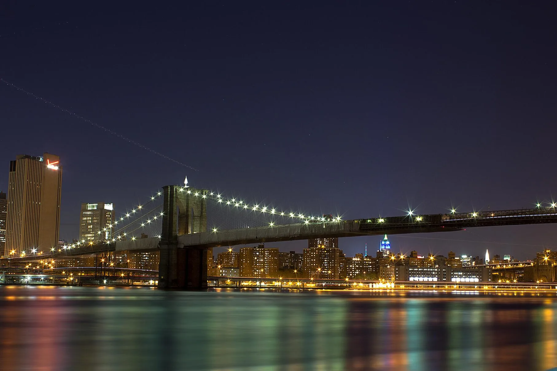 View of Manhattan City Lights and Brooklyn Bridge from Brooklyn Area